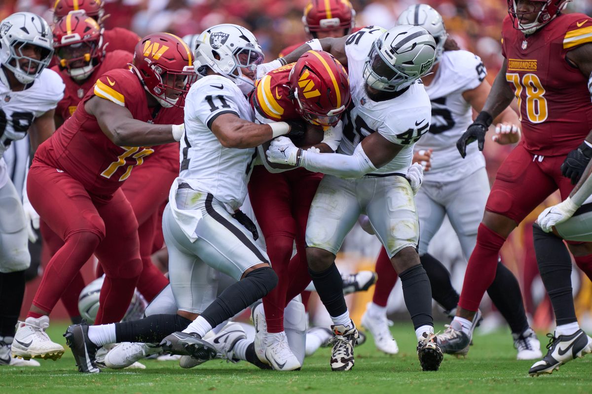 Jacory Croskey-Merritt #22 of the Washington Commanders battles with Jeremy Chinn #11 and Devin White #45 of the Las Vegas Raiders during the first half against the Las Vegas Raiders during an NFL football game at Northwest Stadium on September 21, 2025 in Landover, Maryland. Photo by (M. Shafquat - The Sporting Tribune) Jacory Croskey-Merritt #22 of the Washington Commanders battles with Jeremy Chinn #11 and Devin White #45 of the Las Vegas Raiders during the first half against the Las Vegas Raiders during an NFL football game at Northwest Stadium on September 21, 2025 in Landover, Maryland. Photo by (M. Shafquat - The Sporting Tribune)