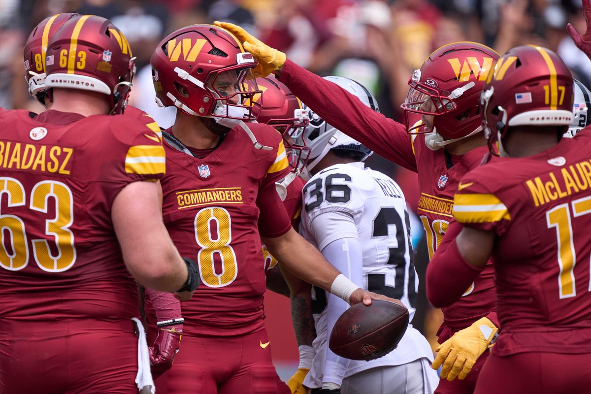 Marcus Mariota #8 of the Washington Commanders celebrates with teammates after scoring a touchdown during the first half against the Las Vegas Raiders during an NFL football game at Northwest Stadium on September 21, 2025 in Landover, Maryland. Marcus Mariota #8 of the Washington Commanders celebrates with teammates after scoring a touchdown during the first half against the Las Vegas Raiders during an NFL football game at Northwest Stadium on September 21, 2025 in Landover, Maryland.