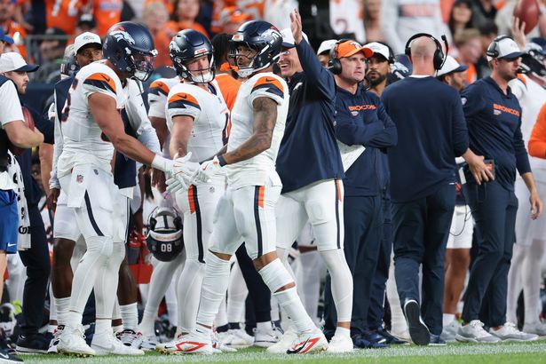 Evan Engram #1 of the Denver Broncos reacts with teammate in the first quarter during the NFL Preseason 2025 game between Arizona Cardinals and Denver Broncos at Empower Field At Mile High on August 16, 2025 in Denver, Colorado. 