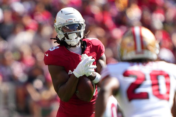 Marvin Harrison Jr. #18 of the Arizona Cardinals drops a pass thrown over the top of Upton Stout #20 of the San Francisco 49ers during the third quarter at Levi's Stadium on September 21, 2025 in Santa Clara, California