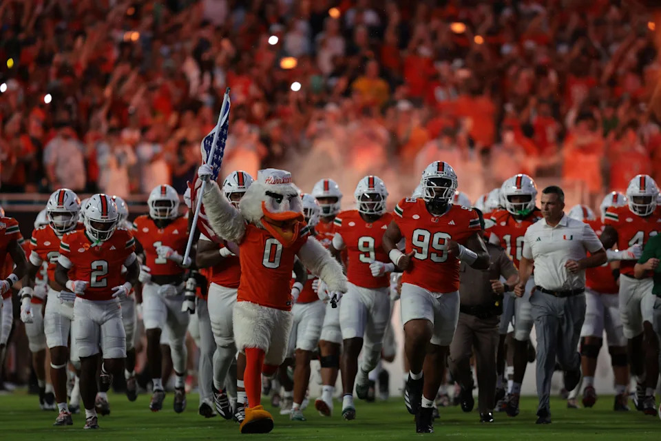 Aug 31, 2025; Miami Gardens, Florida, USA; The Miami Hurricanes take the field before the game against the Notre Dame Fighting Irish at Hard Rock Stadium. Mandatory Credit: Sam Navarro-Imagn Images
