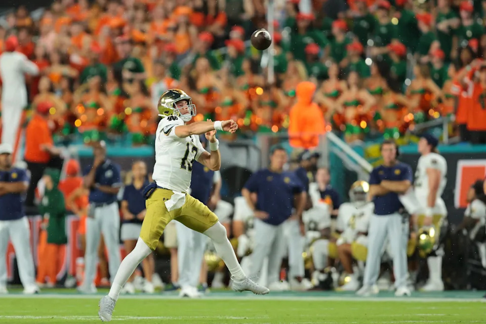 Aug 31, 2025; Miami Gardens, Florida, USA; Notre Dame Fighting Irish quarterback CJ Carr (13) drops back to pass against the Miami Hurricanes during the first quarter at Hard Rock Stadium. Mandatory Credit: Sam Navarro-Imagn Images