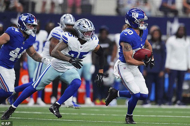 Liufau (No 35) and the Cowboys sealed a dramatic overtime win over the Giants on Sunday