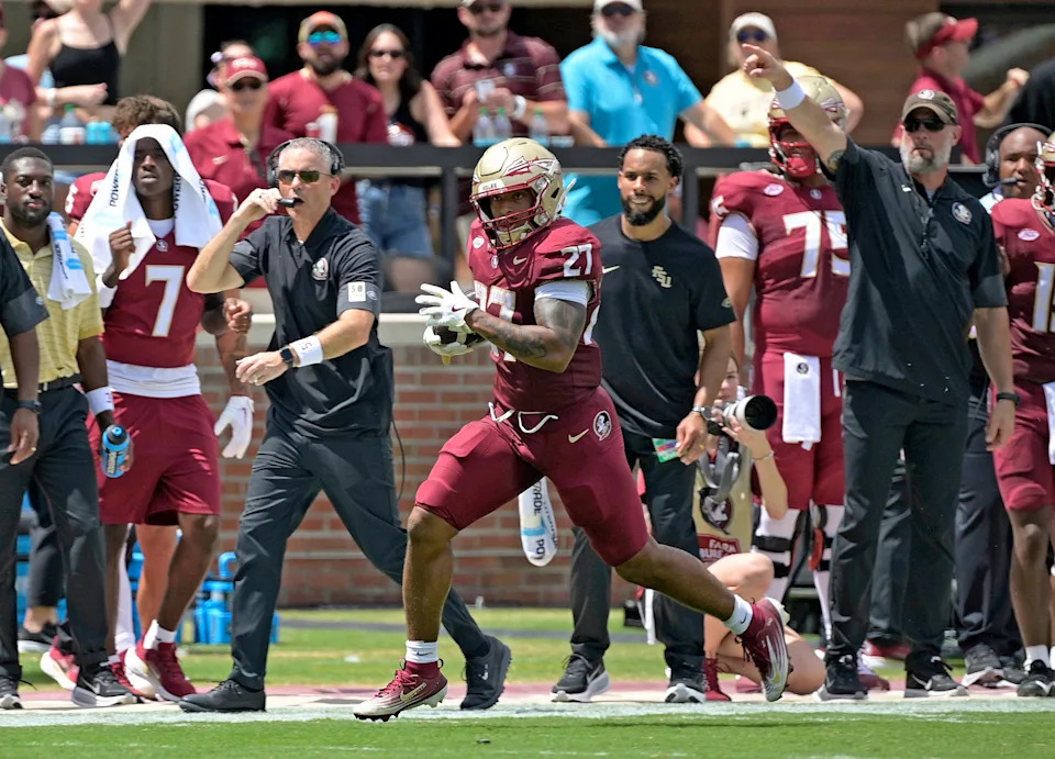 Sep 6, 2025; Tallahassee, Florida, USA; Florida State Seminoles running back Gavin Sawchuck (27) runs down the sideline for a touchdown during the second half against the East Texas A&M Lions at Doak S. Campbell Stadium. Mandatory Credit: Melina Myers-Imagn Images