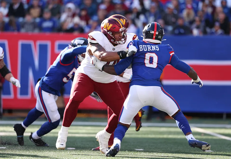 EAST RUTHERFORD, NEW JERSEY - NOVEMBER 03: Brandon Coleman #74 of the Washington Commanders in action against Brian Burns #0 of the New York Giants during their game at MetLife Stadium on November 03, 2024 in East Rutherford, New Jersey. (Photo by Al Bello/Getty Images)