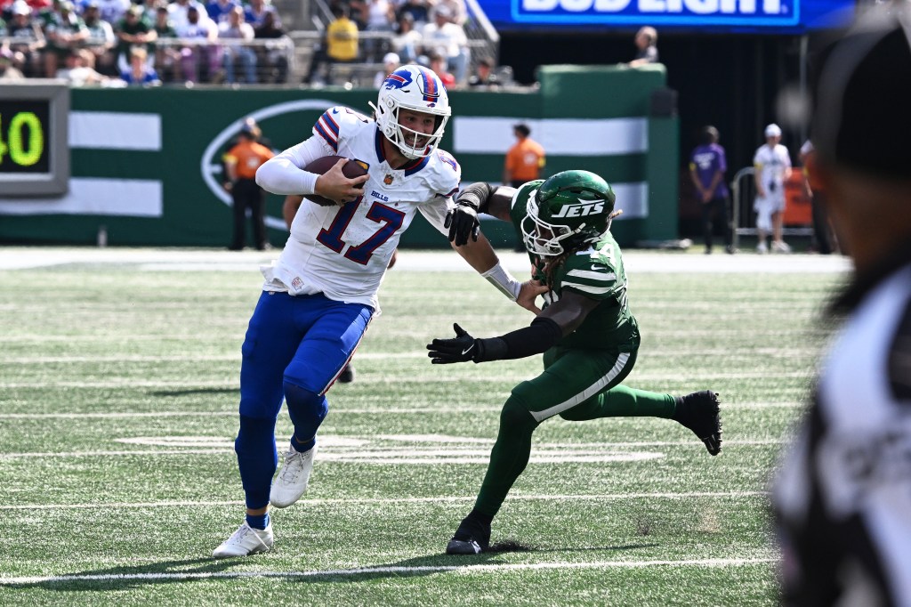 Josh Allen runs with the ball during the Bills-Jets game on Sept. 14, 2025. 