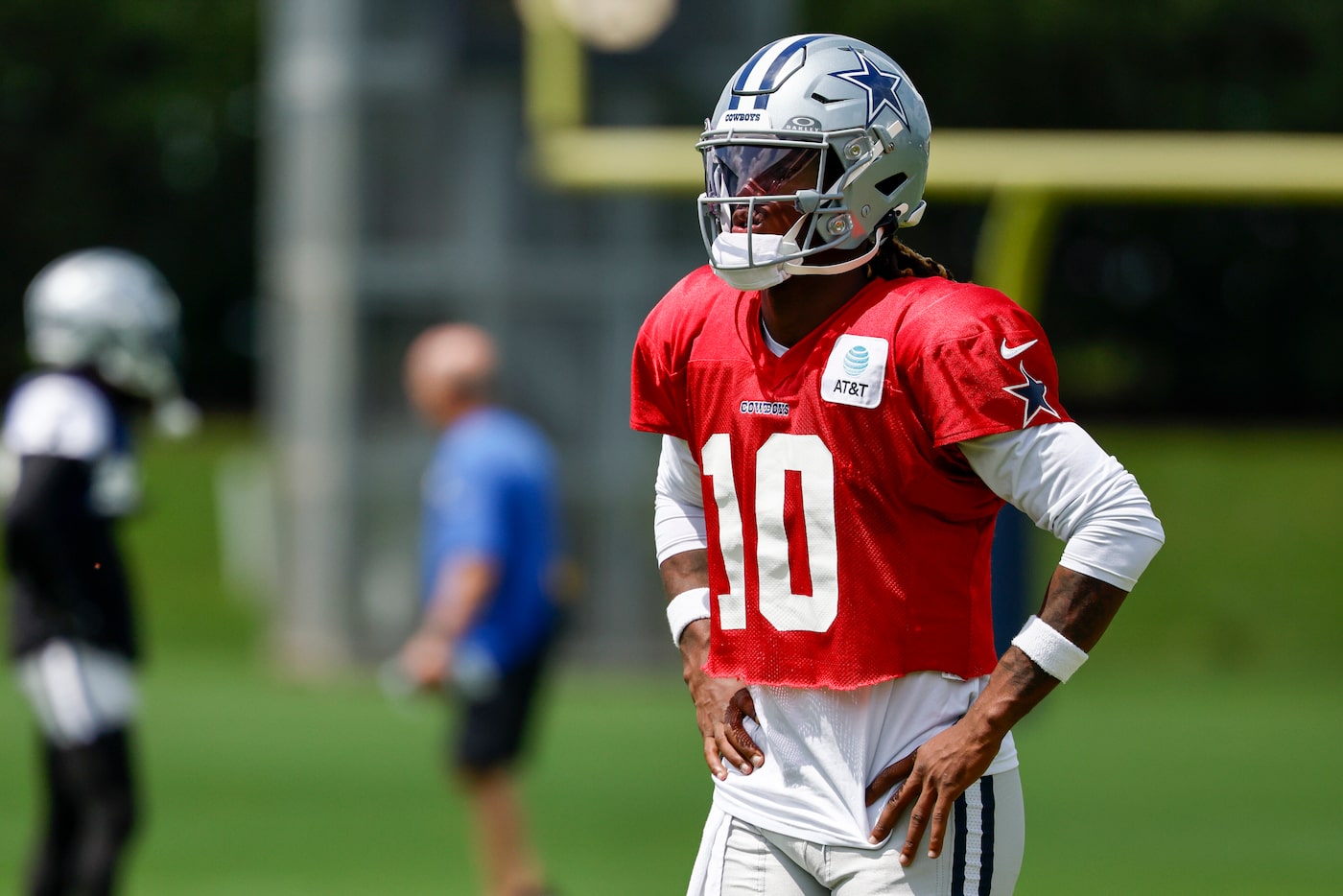 Dallas Cowboys quarterback Joe Milton III (10) stands on the field after a drill during...