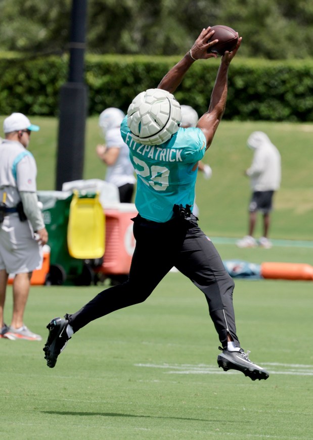 Miami Dolphins safety Minkah Fitzpatrick catches a ball during practice...