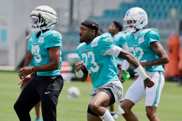 Miami Dolphins cornerback Artie Burns warms up during practice on...