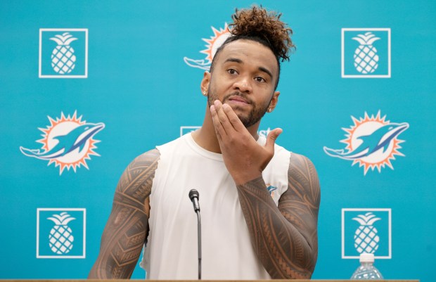Miami Dolphins quarterback Tua Tagovailoa talks to the media after...