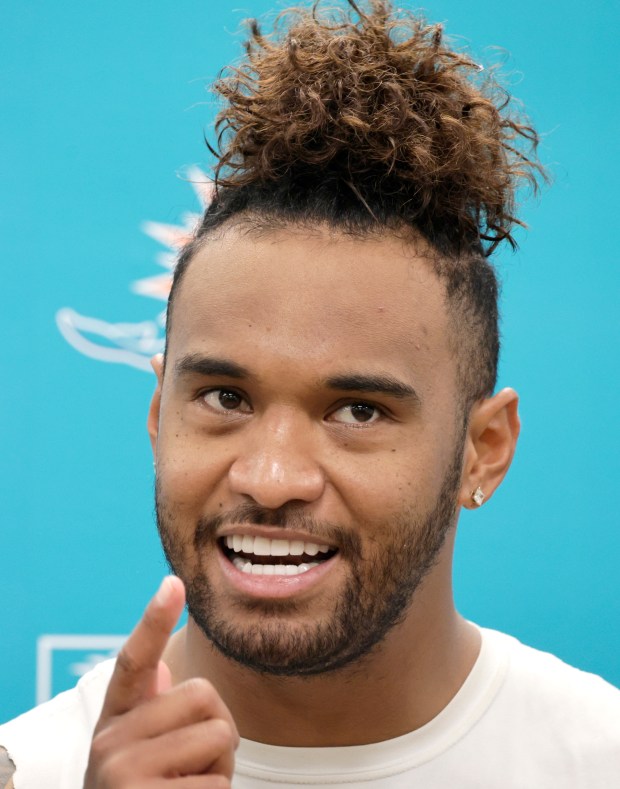 Miami Dolphins quarterback Tua Tagovailoa talks to the media after...