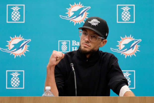 Miami Dolphins coach Mike McDaniel talks to the media before...
