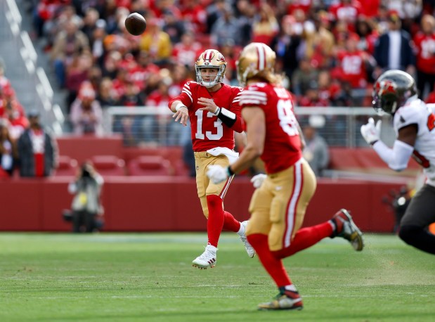 San Francisco 49ers starting quarterback Brock Purdy (13) throws to San Francisco 49ers' George Kittle (85) against the Tampa Bay Buccaneers in the first quarter at Levi's Stadium in Santa Clara, Calif., on Sunday, Dec. 11, 2022. (Nhat V. Meyer/Bay Area News Group)