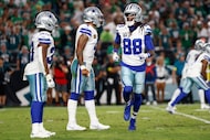 Dallas Cowboys wide receiver CeeDee Lamb (88) moves in motion ahead of quarterback Dak...