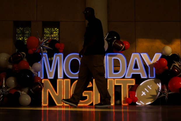 A person walks by a “Monday Night” sign inside Soldier...