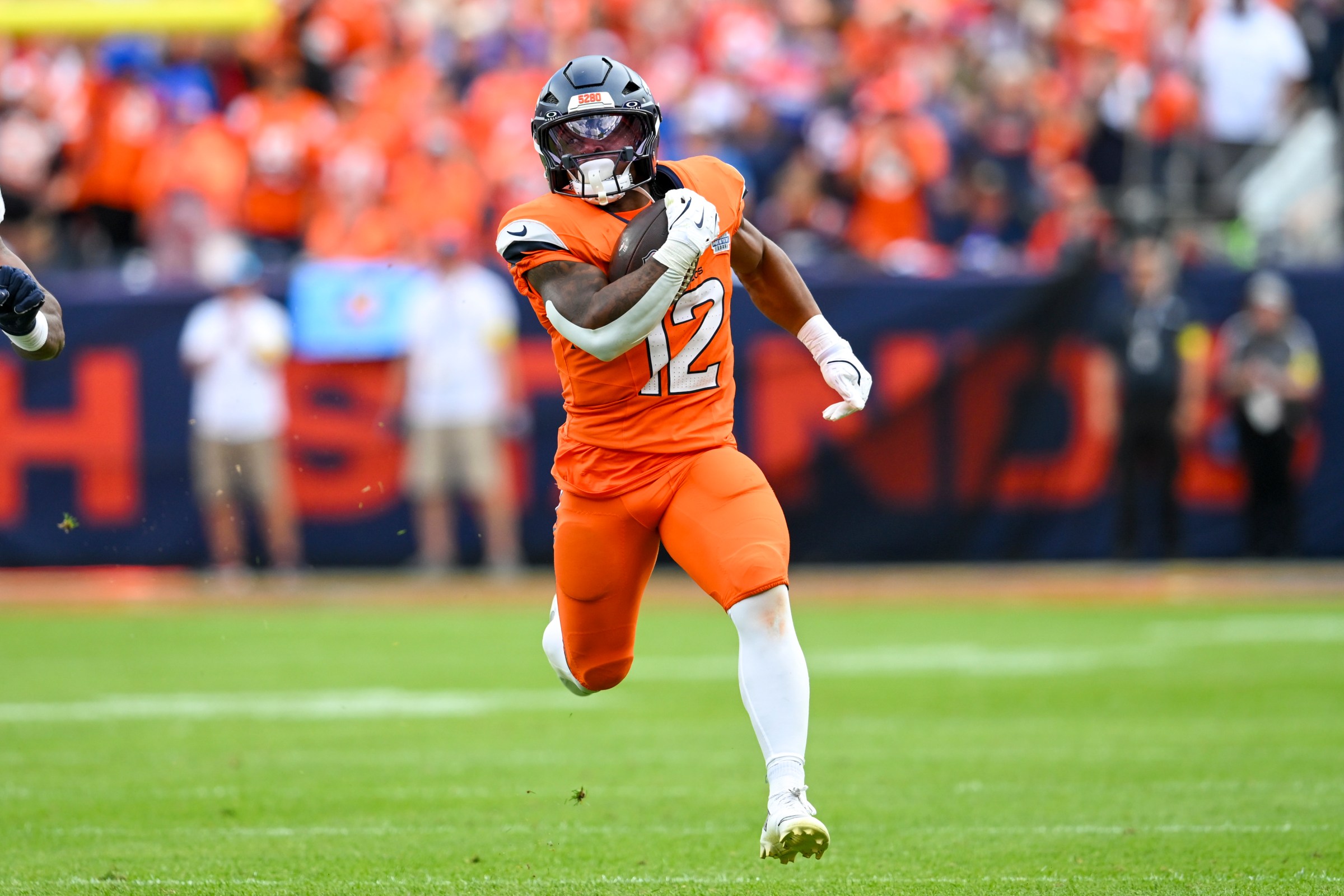 DENVER, CO - SEPTEMBER 07: RJ Harvey #12 of the Denver Broncos runs the ball during a game between the Denver Broncos and the Tennessee Titans at Empower Field at Mile High in Denver, CO on September 07, 2025. (Photo by Kevin Langley/Icon Sportswire via Getty Images)