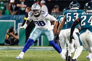 Dallas Cowboys offensive tackle Tyler Guyton (60) drops back as he blocks during the second...