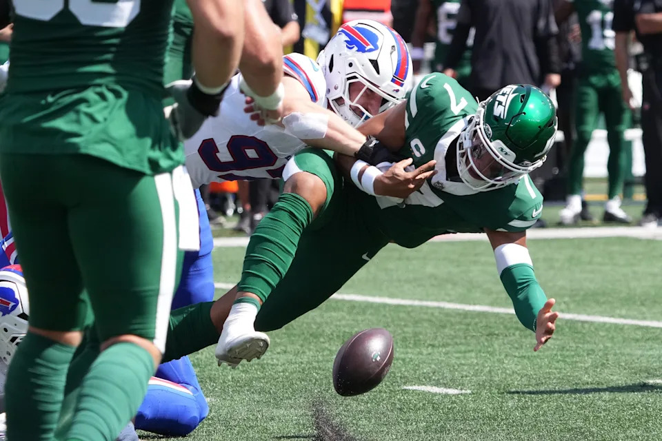 Sep 14, 2025; East Rutherford, New Jersey, USA; Buffalo Bills defensive end Joey Bosa (97) causes a fumble on New York Jets quarterback Justin Fields (7) during the first half at MetLife Stadium. Mandatory Credit: Robert Deutsch-Imagn Images