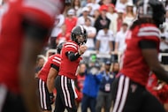 Texas Tech quarterback Behren Morton motions to his receivers during the first half of an...
