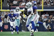 Dallas Cowboys safety Donovan Wilson (6) intercepts a pass intended for New York Giants wide...
