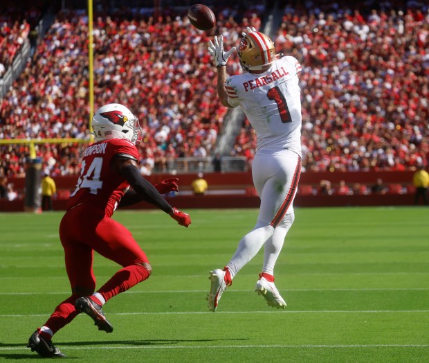 San Francisco 49ers' Ricky Pearsall (1) makes a catch against Arizona Cardinals' Jalen Thompson (34) in the third quarter at Levi's Stadium in Santa Clara, Calif., on Sunday, Sept. 21, 2025. (Nhat V. Meyer/Bay Area News Group)