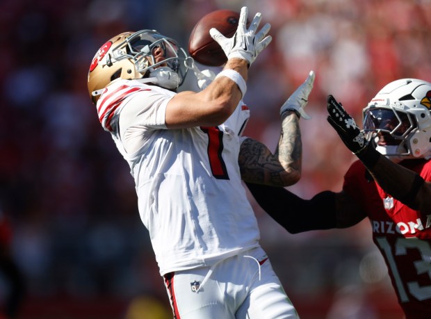 San Francisco 49ers' Ricky Pearsall (1) makes a 34-yard catch for a first down against Arizona Cardinals' Kei'Trel Clark (13) in the fourth quarter at Levi's Stadium in Santa Clara, Calif., on Sunday, Sept. 21, 2025. (Nhat V. Meyer/Bay Area News Group)