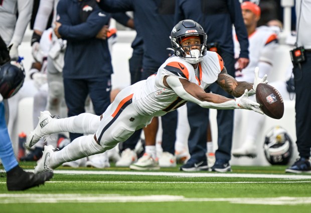 Courtland Sutton (14) of the Denver Broncos cannot haul in a deep pass from Bo Nix (10) with the game on the line during the fourth quarter of the Los Angeles Chargers' 23-20 win at SoFi Stadium in Inglewood, California on Sunday, Sept. 21, 2025. (Photo by AAron Ontiveroz/The Denver Post)