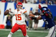 Kansas City Chiefs quarterback Patrick Mahomes throws as New York Giants outside linebacker...