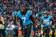 Carolina Panthers linebacker Jadeveon Clowney (7) runs onto the field before taking on the...