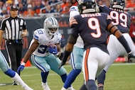 Dallas Cowboys running back Javonte Williams (33) carries the ball as Chicago Bears safety...