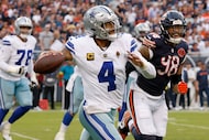 Dallas Cowboys quarterback Dak Prescott (4) passes under pressure of Chicago Bears defensive...