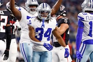 Dallas Cowboys running back Jaydon Blue (34) reacts after scoring a rushing touchdown during...