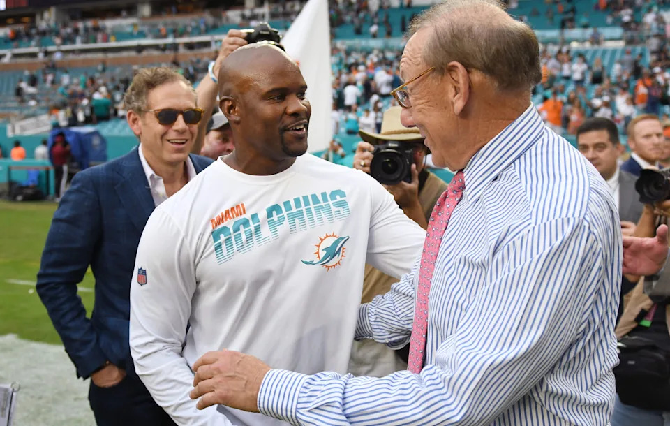 Miami Dolphins head coach Brian Flores is congratulated by Miami Dolphins owner Stephen Ross after the victory over the Philadelphia Eagles.