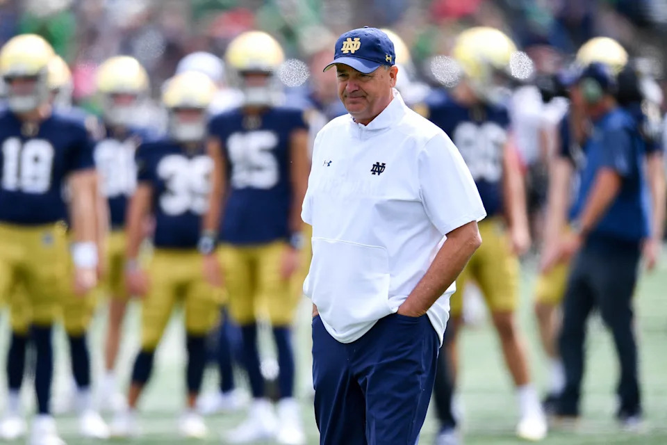 Sep 7, 2024; South Bend, Indiana, USA; Notre Dame Fighting Irish Offensive Coordinator Mike Denbrock watches warmups before the game against the Northern Illinois Huskies at Notre Dame Stadium. Mandatory Credit: Matt Cashore-Imagn Images