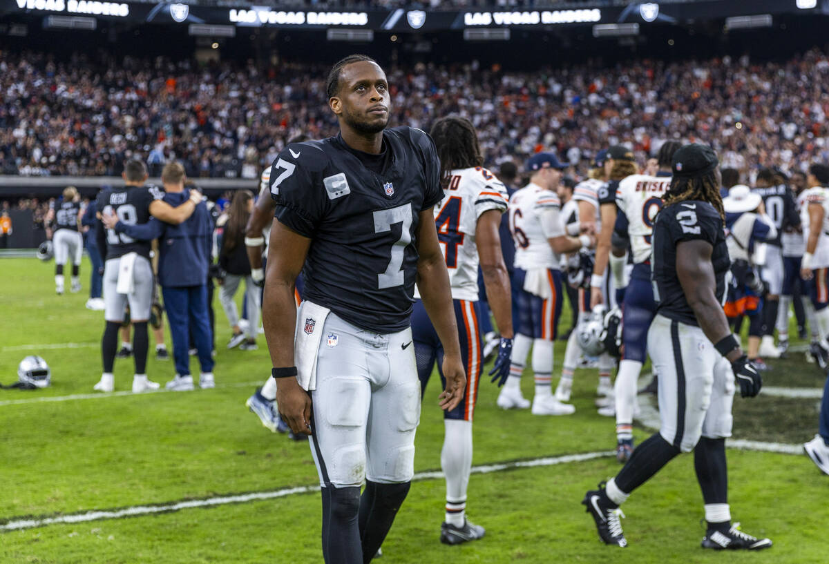 Raiders quarterback Geno Smith (7) unhappily walks off the field after a late loss to the Chica ...