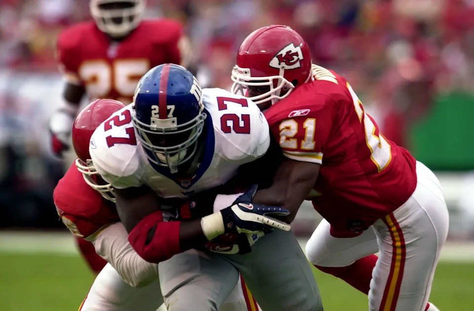 23 Sept 2001: #21 of the Kansas City Chiefs tackle #27 of the New York Giants at Arrowhead Stadium in Kansas City, Missouri. The Giants beat the Chiefs 13-3. DIGITAL IMAGE. Mandatory Credit: Elsa/Allsport
