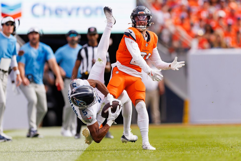 Riley Moss #21 of the Denver Broncos defends a pass.