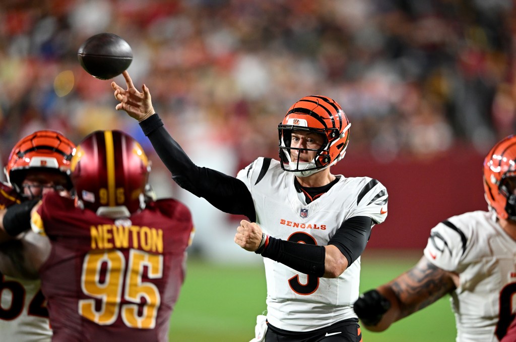 Cincinnati Bengals quarterback throwing a football.