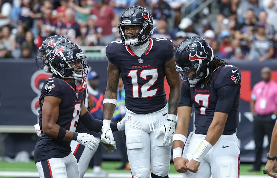 Nov 24, 2024; Houston, Texas, USA; Houston Texans wide receiver Nico Collins (12) celebrates with quarterback C.J. Stroud (7) and wide receiver John Metchie III (8) after a touchdown during the second quarter against the Tennessee Titans at NRG Stadium. Mandatory Credit: Troy Taormina-Imagn Images