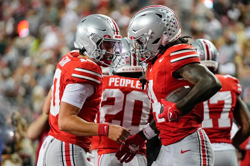 Ohio State Buckeyes quarterback Julian Sayin (10) celebrates a touchdown by wide receiver Jeremiah Smith (4) during the second half of the NCAA football game against the Ohio Bobcats at Ohio Stadium on Sept. 13, 2025. Ohio State won 37-9.