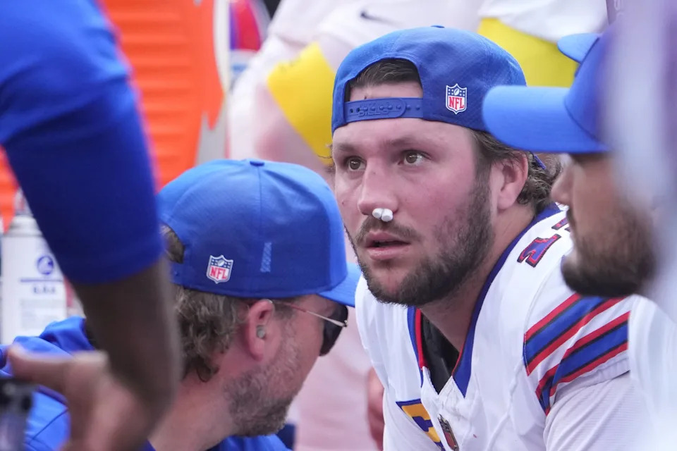 Sep 14, 2025; East Rutherford, New Jersey, USA; Buffalo Bills quarterback Josh Allen (17) is tended to by medical staff on the bench during the first half at MetLife Stadium. Mandatory Credit: Robert Deutsch-Imagn Images
