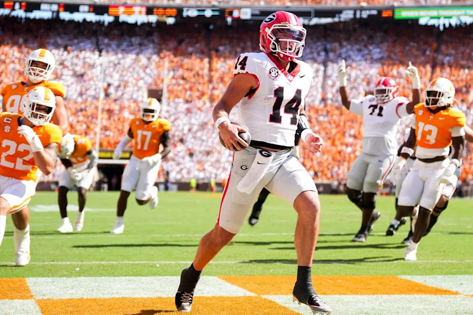 Georgia quarterback Gunner Stockton (14) runs into the end zone for a touchdown during a college football game between Tennessee and Georgia at Neyland Stadium in Knoxville, Tenn., on Sept. 13, 2025.