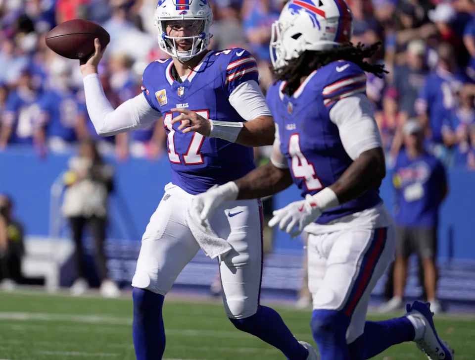 Buffalo Bills quarterback Josh Allen looks at running back James Cook as he launches a short pass to him during second half action of the Bills home game against the New Orleans Saints in Orchard Park on Sept. 28, 2025.