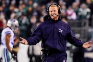 Dallas Cowboys head coach Jason Garrett argues a call during the first half of an NFL...