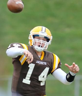 Baldwin-Wallace quarterback Ryan O'Rourke eludes a sack and throws around Mount Union defensive lineman Frank Orteca in first quarter action of Mount Union's 41-13 win over Baldwin Wallace at George Finnie Stadium in Bera, Ohio, Saturday, November 6, 2010. MORNING JOURNAL/NATE PARSONS