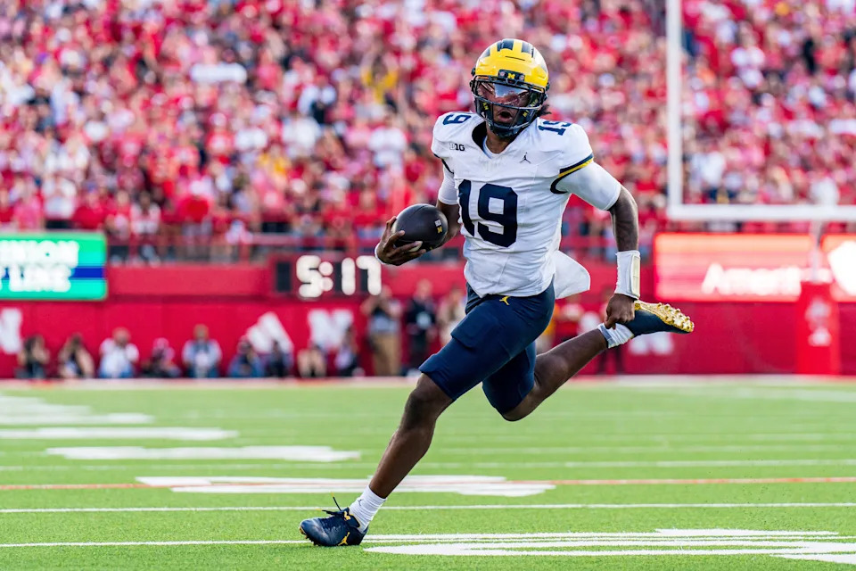 Sep 20, 2025; Lincoln, Nebraska, USA; Michigan Wolverines quarterback Bryce Underwood (19) runs against the Nebraska Cornhuskers during the fourth quarter at Memorial Stadium.