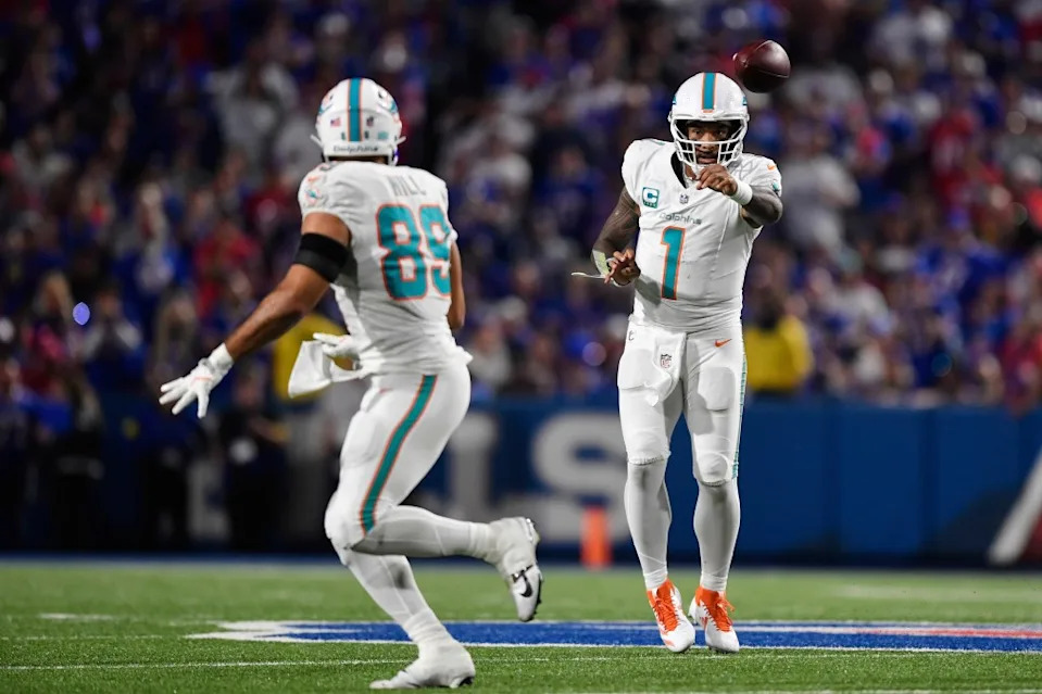 Miami Dolphins quarterback Tua Tagovailoa (1) passes the ball to tight end Julian Hill (89) during the second half of an NFL football game against the Buffalo Bills, Thursday, Sept. 18, 2025, in Orchard Park, N.Y. AP