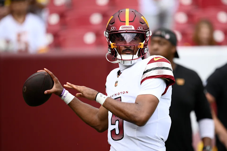 Commanders quarterback Jayden Daniels warms up before a Week 1 game against the New York Giants. (AP Photo/Nick Wass)