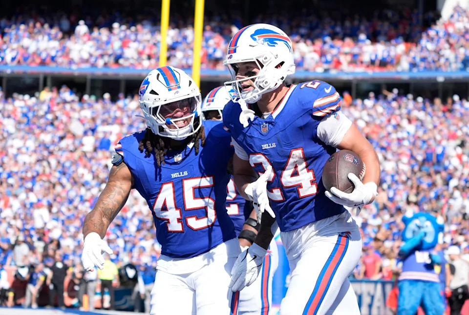 Sep 28, 2025; Orchard Park, New York, USA; Buffalo Bills safety Cole Bishop (24) and outside linebacker Shaq Thompson (45) celebrate after intercepting a pass intended for New Orleans Saints quarterback Spencer Rattler (2) during the second quarter at Highmark Stadium. Mandatory Credit: Gregory Fisher-Imagn Images
