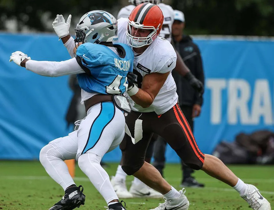 Panthers outside linebacker Thomas Incoom, right, avoids defense by Browns tackle Jackson Barton during joint practice at training camp in Charlotte on Aug. 6.